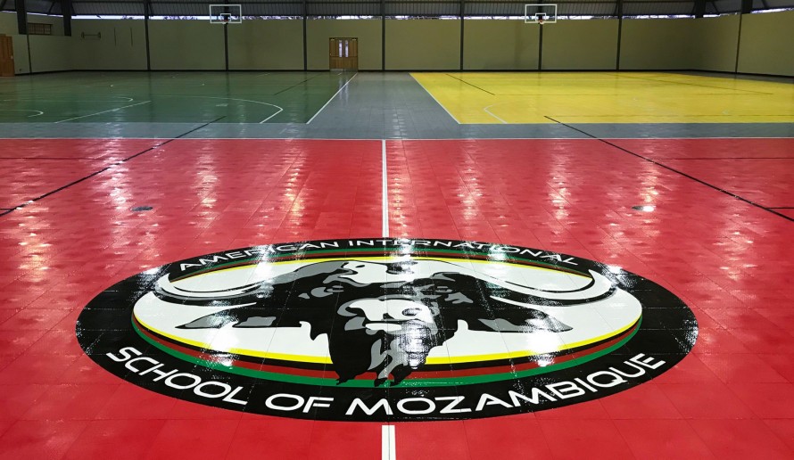 Closeup of the 3 by 2.4 meter American International Mozambique logo on the new flooring.