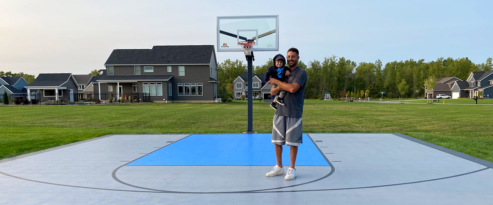 Father and child on their new court