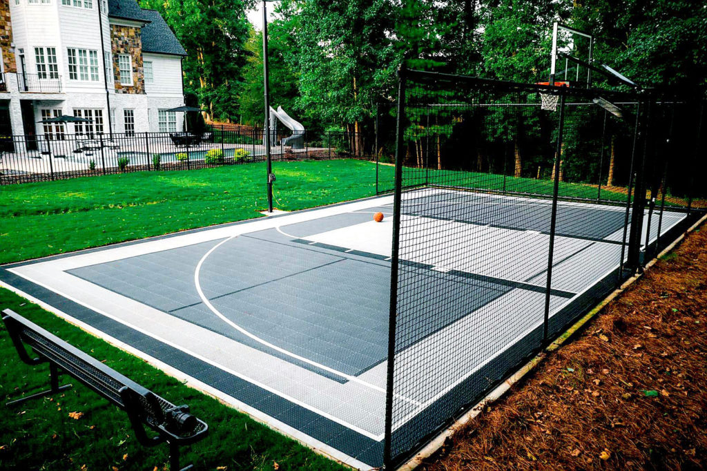 Grayscale backyard half-court with multi-game lines
