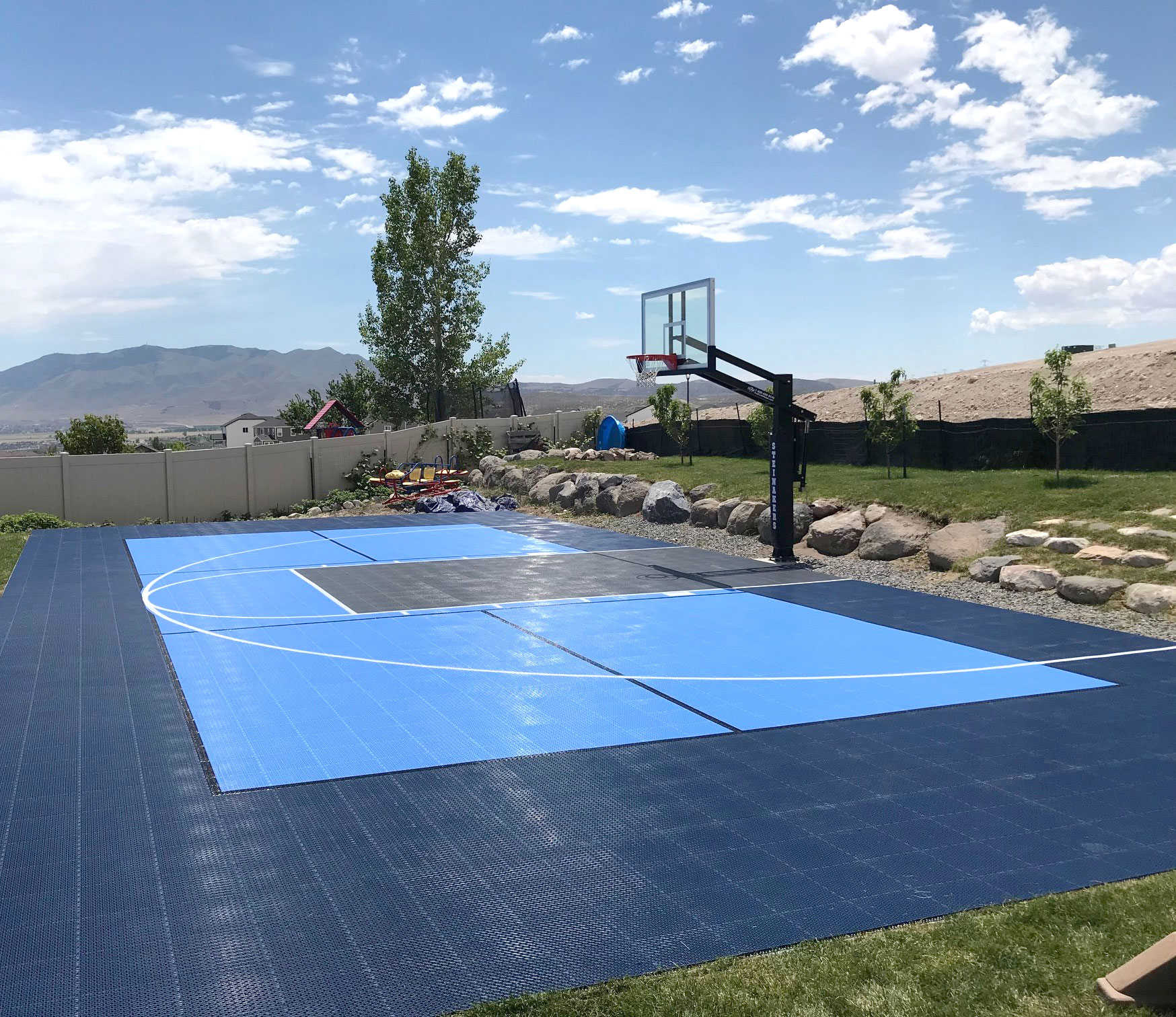 30 x 60 Dark blue, sky blue and graphite backyard multi-court in Saratoga Springs
