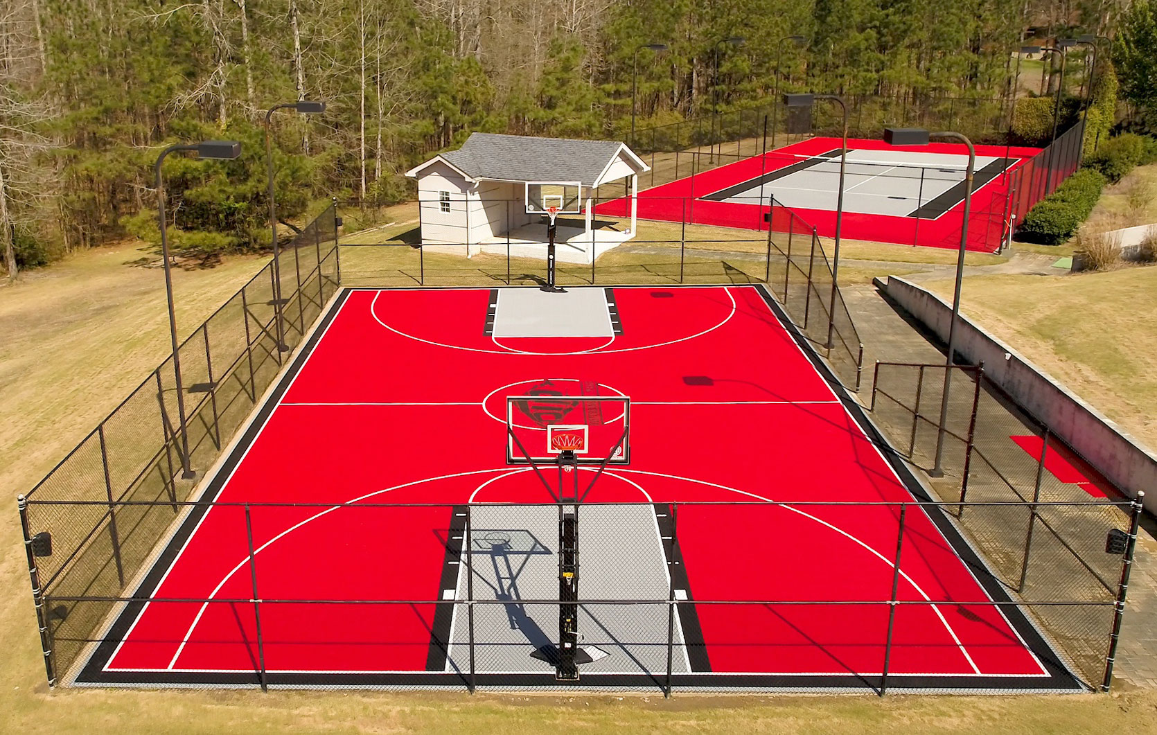Red, gray and black basketball and tennis courts