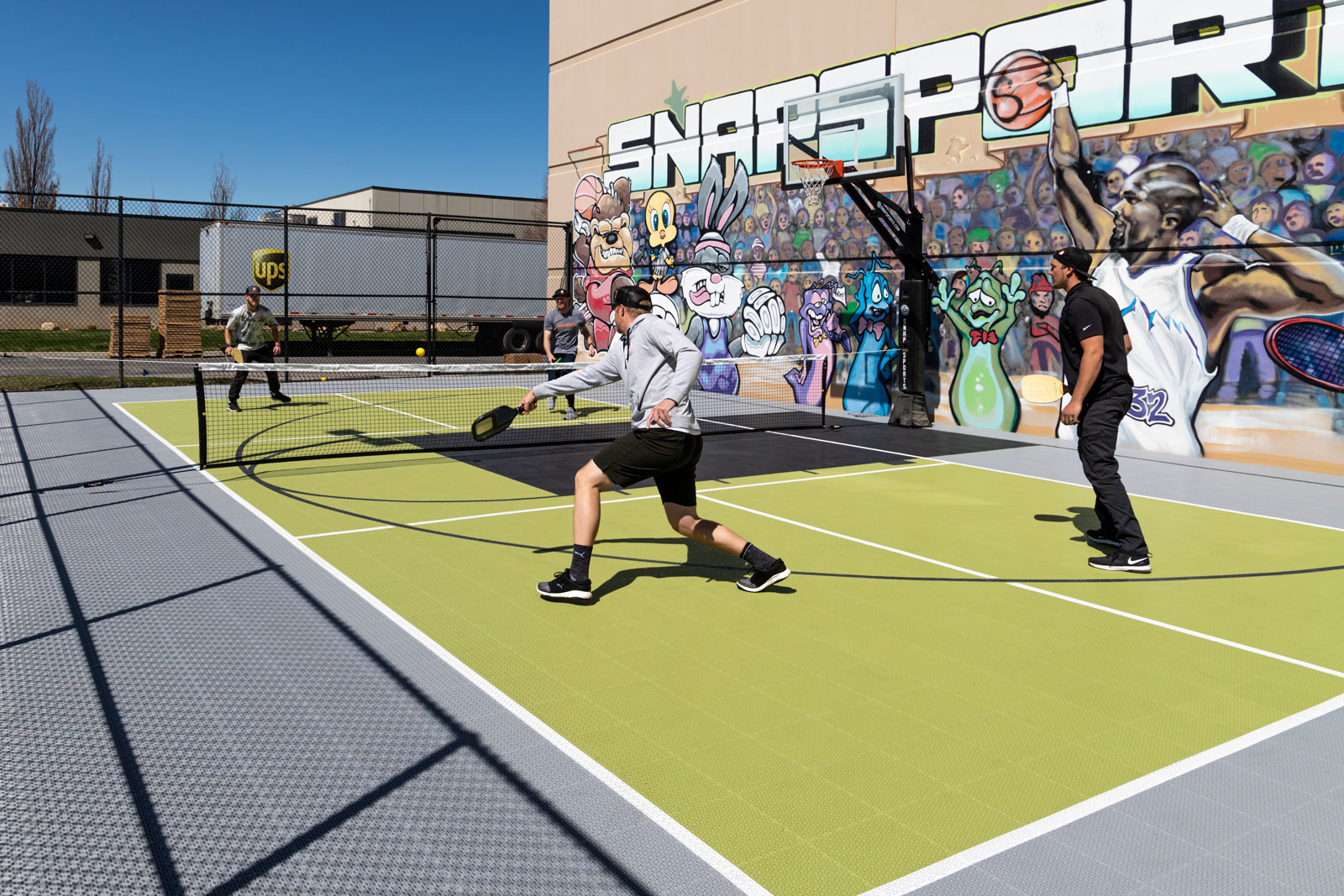Pickleball players continue their game on the Outdoor Revolution PS Pickleball Surfacing