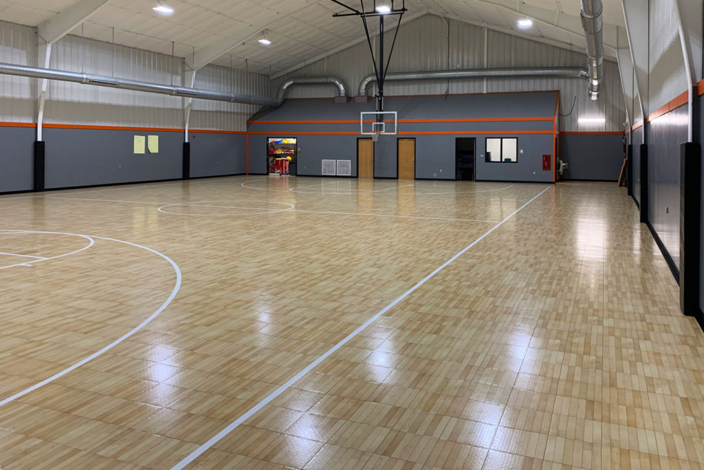 Maple TuffShield Revolution flooring in an indoor basketball court
