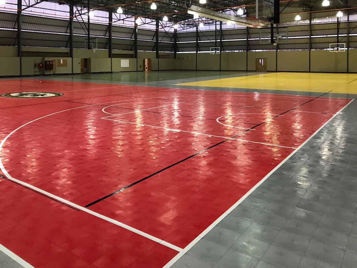 Alternate view of the brand new multi-courts. Painted lines for a variety of sports and a custom logo can be seen.