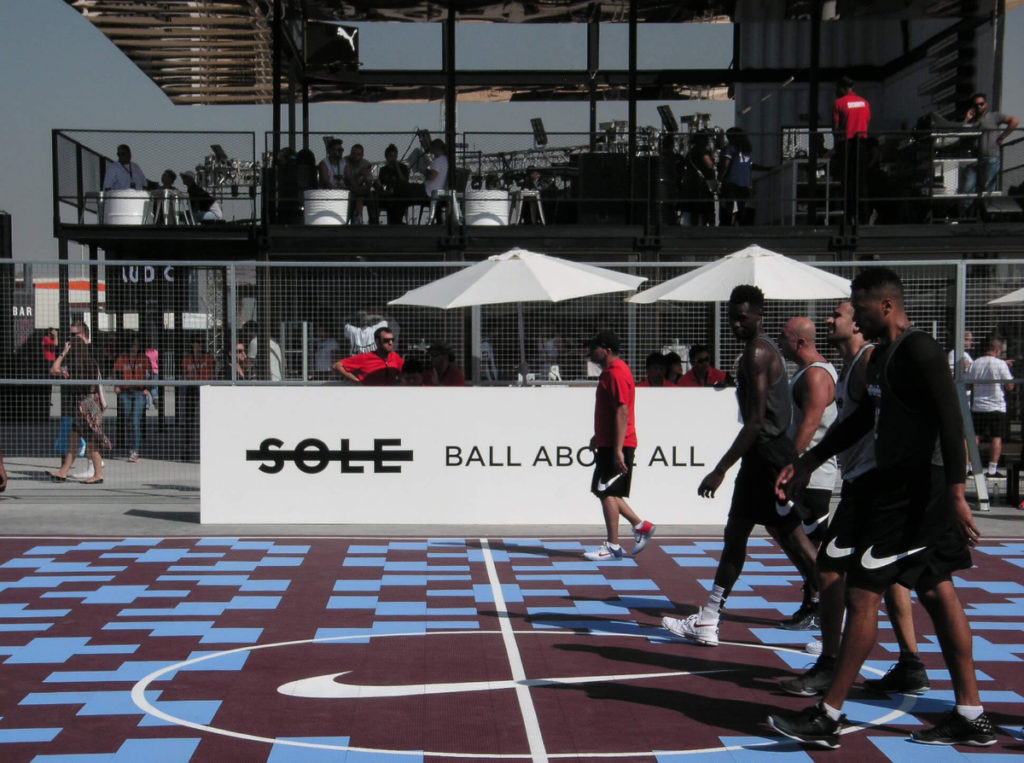 Players walking on the custom SnapSports playing surface for the 2016 Sole Ball Above All event