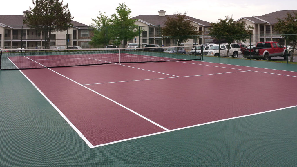 Evergreen and burgundy tennis court