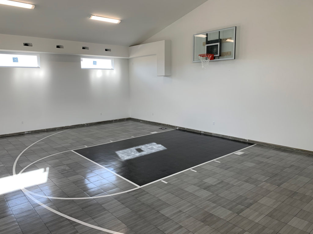 Gray maple and black Revolution basketball court