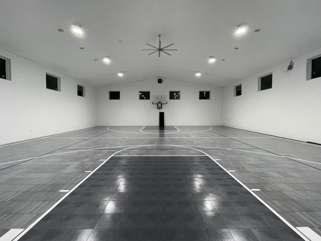 Indoor multi-court with gray Maple Tuffshield and graphite