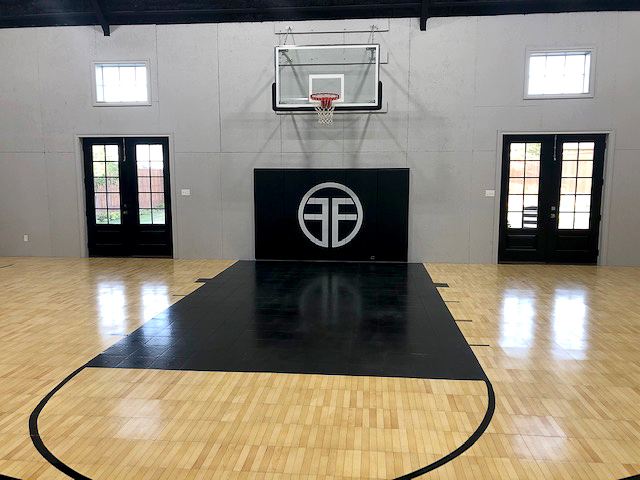 Indoor basketball court with Indoor Revolution Maple TuffShield and Black