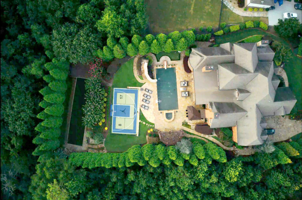 Drone view of steel blue and kiwi backyard multi-court