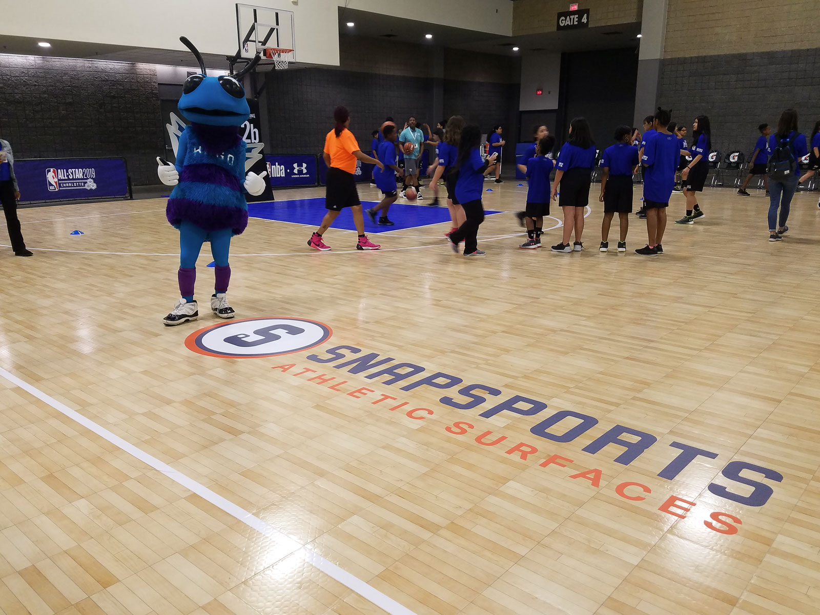 Hugo the Hornet giving thumbs up next to the SnapSports logo