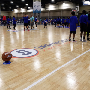Jr. NBA participants line up with their coaches.
