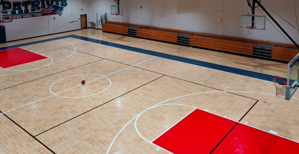 Maple and red Revolution in a middle school gym