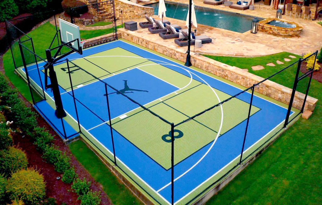 Backyard multi-court with fencing, SnapBack, basketball hoop and lighting