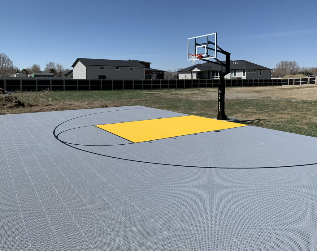 Basketball court with Outdoor Revolution in gray and yellow