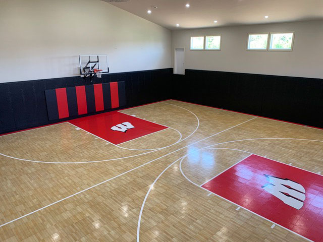 Indoor Revolution maple and bright red indoor basketball court with custom logos