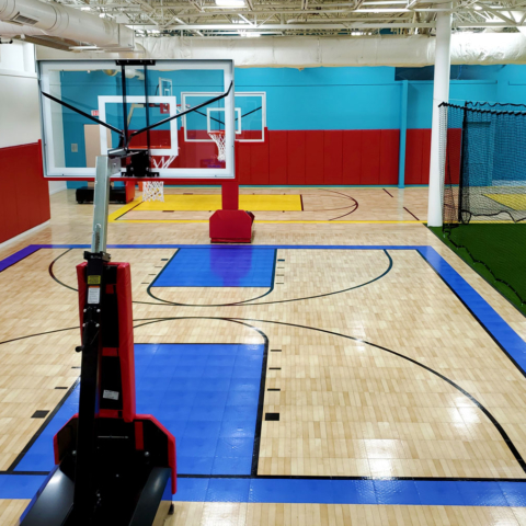 Indoor basketball courts with Maple Tuffshield and accent colors