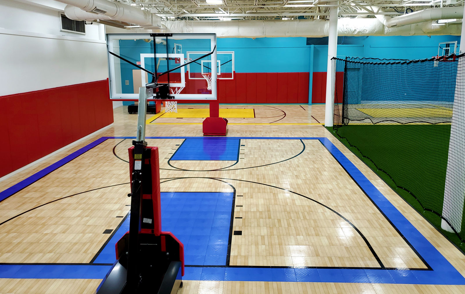 Indoor basketball courts with Maple Tuffshield and accent colors