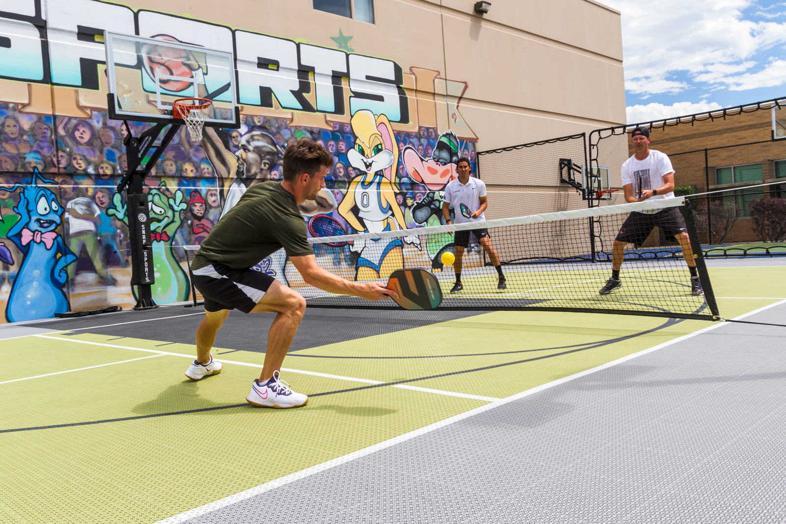 Tyler Loong and friends play Pickleball on the new Outdoor Revolution PS surfacing.