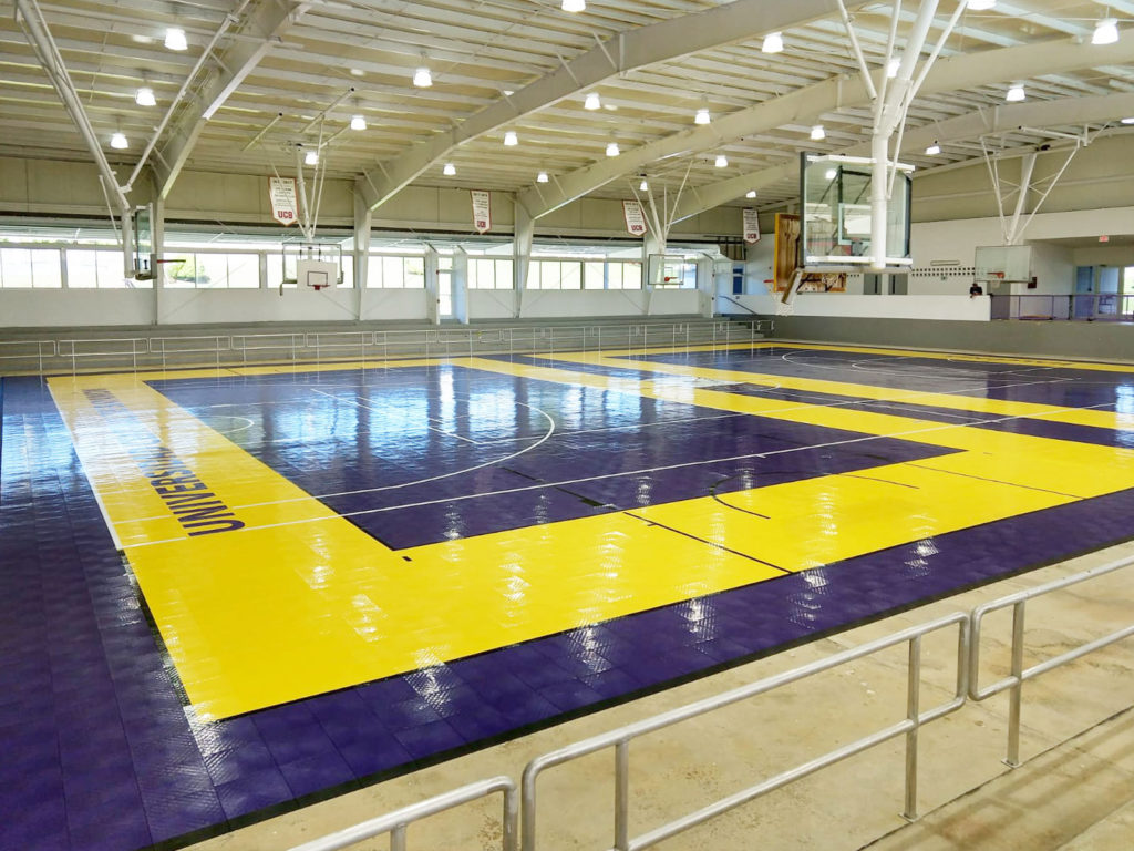 Purple and yellow court at Universidad Central de Bayamon