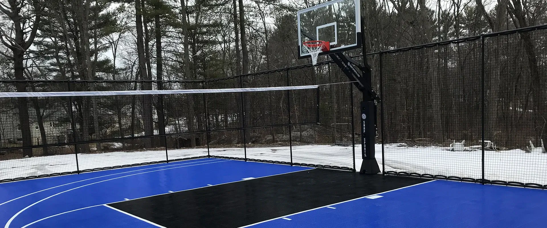 Volleyball court in a snowy backyard