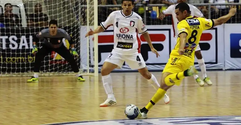 commercial futsal courts A futsal player goes for a goal in a futsal match on Revolution with Light-Maple TuffShield