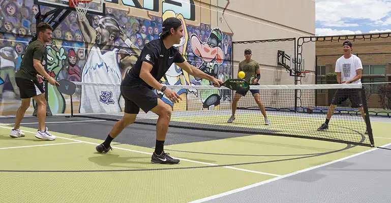commercial pickleball courts Tyler Loong and friends play a game on SnapSports PickleGrip tiles.